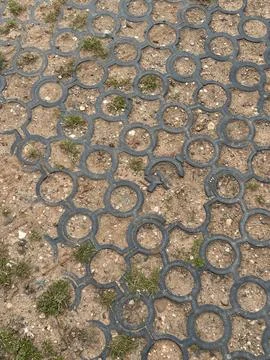 Interlocking Circle Paver Ground Cover Tiles Over Dirt Surface Stock Photos