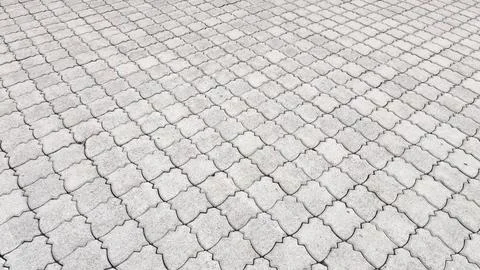 Interlocking Concrete Pavement Pattern Background with Geometric Paver Blocks Stock Photos