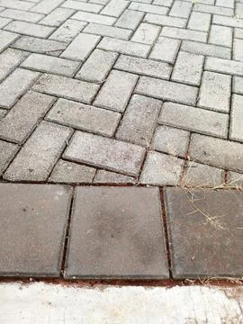 Interlocking Concrete Paving Blocks with Sidewalk Curb Texture Stock Photos