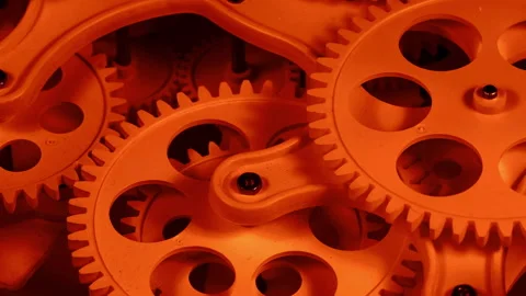 Interlocking Gears in Warm Orange Light Industrial Concept Stock Footage 331327747