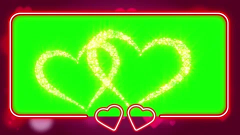 Interlocking golden glittering heart outlines displayed over vibrant green Stock Footage 345334434