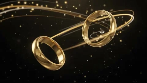 Interlocking Golden Wedding Rings, Elegant 3D Rotating with Light Rays Particles Stock Footage 341963820