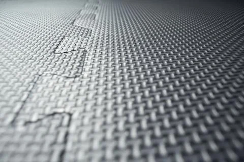 Interlocking jigsaw floor tiles inside a fitness studio or gym Stock Photos