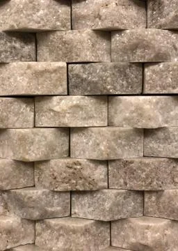 Interlocking marbled quartz brick background photograph. Stock Photos