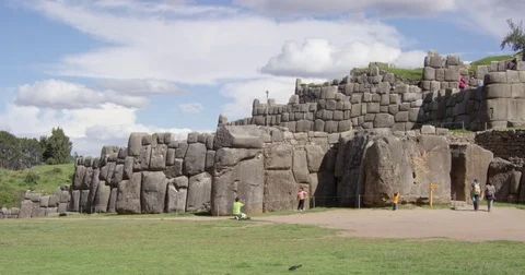 The Interlocking Megalithic Stone Blocks of Sacsayhuaman with Tourists for Scale Stock Footage 78741791