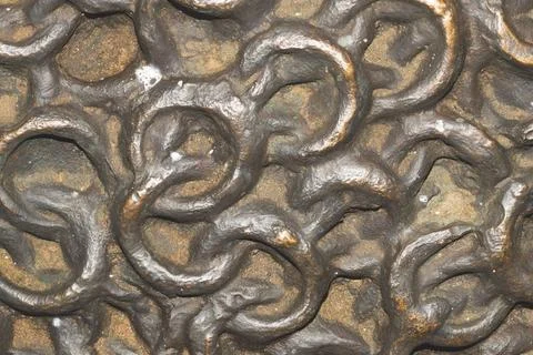 Interlocking metal chainmail rings texture with bronze and rust patina Stock Photos