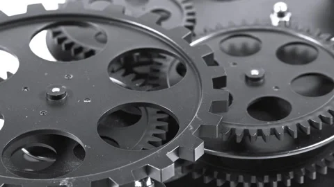 Interlocking Metal Gears Turning in Mechanical Gearwork System Stock Footage 340531563