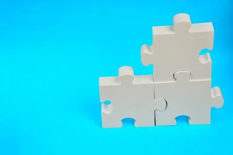 Interlocking puzzle pieces for teamwork and problem solving Stock Photos