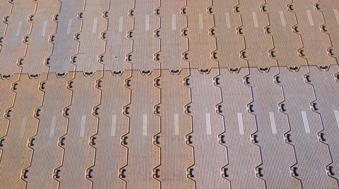 Interlocking rubber soundproofing floor plastic paving tiles brown background Stock Photos