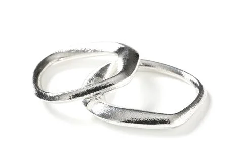 Interlocking silver rings on white background, connection and unity concept,  Stock Photos