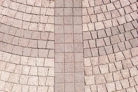 Interlocking stone pavement pattern with central divider Stock Photos