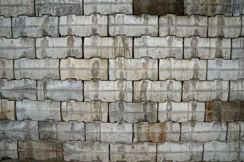 Interlocking wall with gray and brown concrete blocks. Concrete products Cons Stock Photos