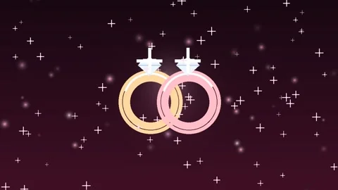 Interlocking Wedding Rings Animation with Starry Background 動画素材 347814009