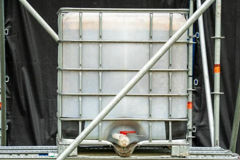 Intermediate Bulk Container IBC Tote Tank in Metal Cage Frame Stock Photos