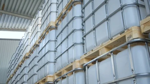 Intermediate Bulk Containers in Metal Frames in Light Rays Stock Footage 76136013