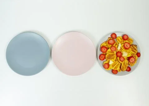 Intermittent fasting concept with empty colorful plates. Time to lose weight Stock Photos