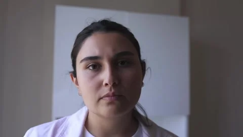 Intern-doctor with sad expression stands in hospital ward Stock Footage 248981570