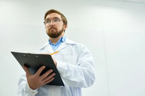 Intern Holding Clipboard Stock Photos