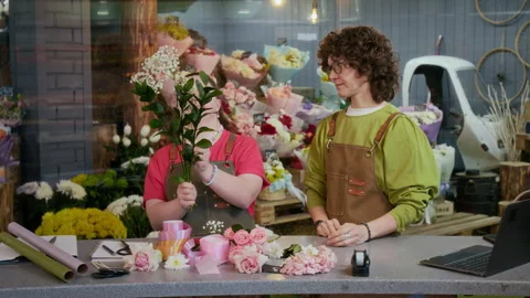 Intern Learning to Make Floral Composition, Female Florist Watching Her Stock Footage 302373363