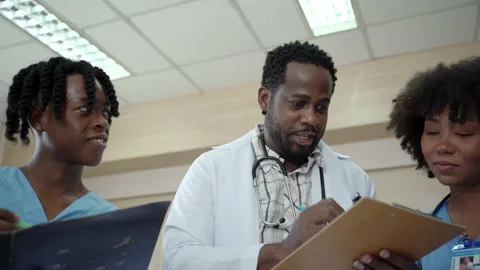 Intern or medical student talking to medical lecturer. Stock Footage 182000677