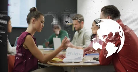 Intern reaching for report scanning charts jotting notes in business meeting Video stock 330179950