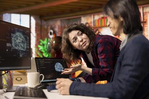 Intern requests help from CTO manager in Silicon Valley workplace Stock Photos