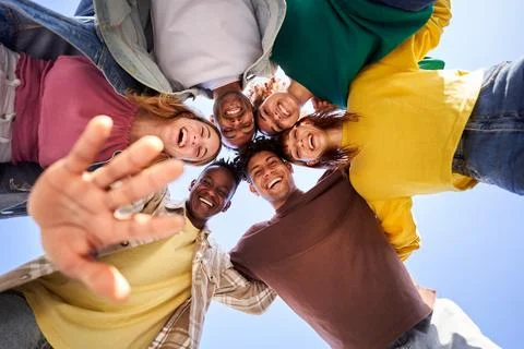 Internacional Erasmus students looking at camera cheerfully embracing each other Stock Photos