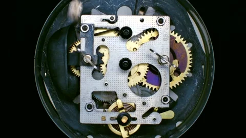 Internal clockwork mechanism ringing on black background Stock Footage 310522043