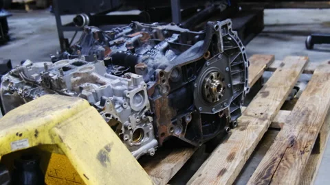 Internal combustion engine with attached gearbox stands on pallet Stock Footage 317630850