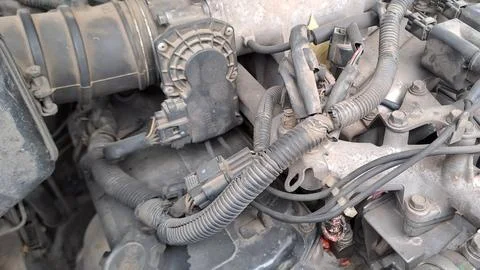 Internal combustion engine details under the hood of a modern vehicle 스톡 사진