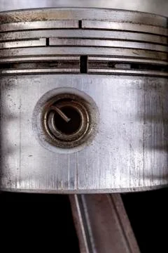 Internal combustion engine piston mounted in the cylinder. View of the piston Stock Photos