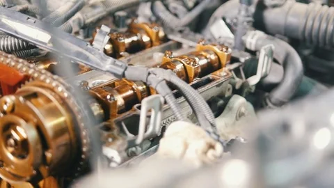 The internal combustion engine, repair at car service, details under the hood of Stock Footage 83425830