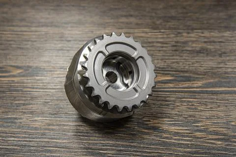 Internal combustion engine VVTI clutch on wooden background Stock Photos