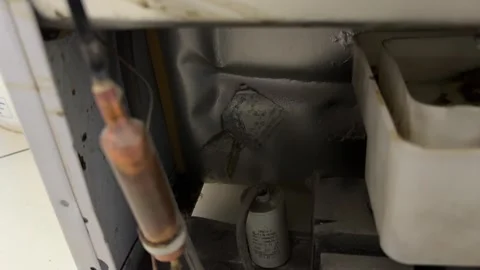 Internal components of refrigerator in close up, cooling system mechanism and Stock Footage 337116857