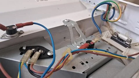 Internal electrical components and wiring inside a residential microwave oven Stock Photos