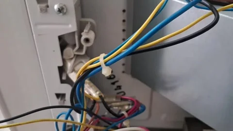 Internal electrical wiring connections inside an appliance showing motion video Stock Footage 339374451