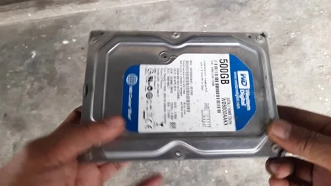 Internal hard disk drive, silver metal casing with blue product label, hard.. Stock Footage 345114992