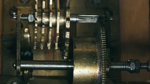 Internal mechanical cog wheel mechanism of metronome action MACRO shot Stock Footage 315099620