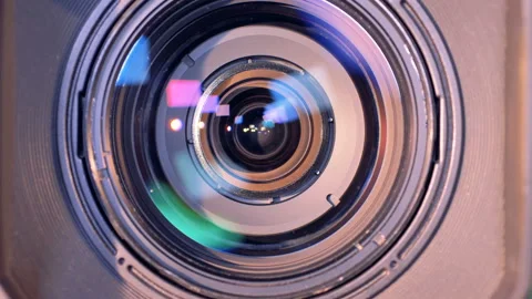 Internal objective lens of a video camera is zooming in Stock Footage