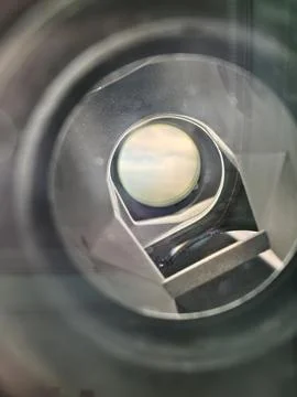 Internal optical view through telescope eyepiece showing lenses and mirrors Stock Photos