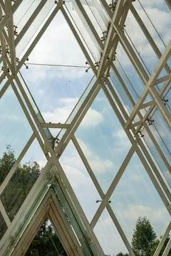 Internal roof structure of a triangular glass house Stock Photos