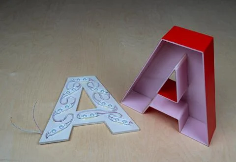 The internal structure of the light letter is part of an advertising sign. Stock Photos