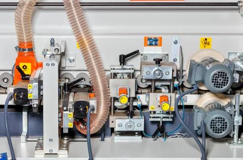 The internal structure of a modern woodworking machine with a sawdust and sha Stock Photos