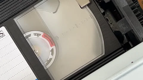 Internal view of VHS cassette playing, stopping and rewinding Stock Footage 316820019