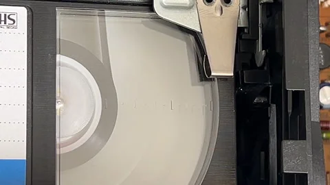 Internal view of VHS cassette rewinding, being ejected and reloaded Stock Footage 316820077