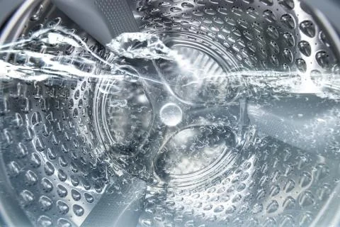 Internal view of a washing machine drum during wash Stock Photos