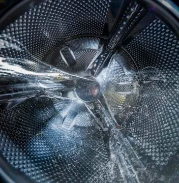 Internal view of a washing machine drum filled with water Stock Photos