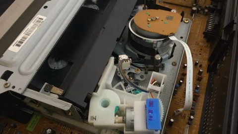 Internal workings of a VHS VCR ejecting a cassette Stock Footage 104685033