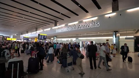 International Arrivals at London Heathrow Airport Terminal 2 Stock Footage