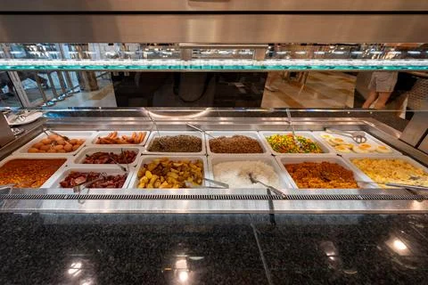 International breakfast buffet featuring eggs, sausages, bacon, rice, potat.. Stock Photos